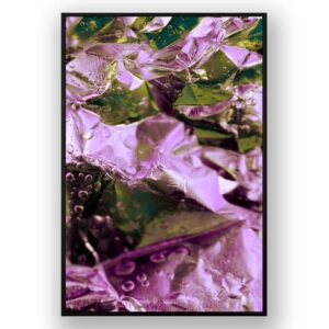 Close-up of crinkled metallic foil with purple and green reflections and scattered water droplets.