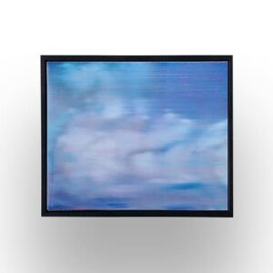 A framed painting or print depicting a blurry, abstract sky with blue and white tones, mounted on a white wall.
