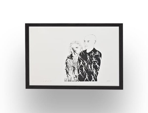 A black-and-white framed artwork depicting two people, with one partially obscured and the other’s clothing covered in small human silhouettes.