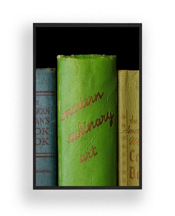 Framed image of three vintage cookbooks standing upright, with the green spine of "Modern Culinary Art" prominently displayed in the center.