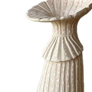 A white decorative pedestal or stand with a fluted, shell-like top and a textured, ribbed surface featuring a subtle pink dotted pattern.