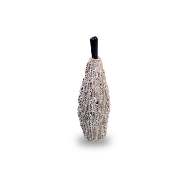A tall, textured beige ceramic vase with a black narrow neck and red accents, standing upright on a white background.