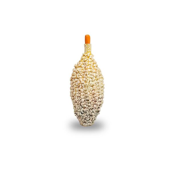 A bottle covered in popcorn pieces with an orange bottle cap, placed upright on a white background.