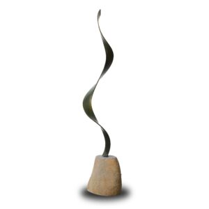 A tall, slender, metal sculpture with a twisting, spiral shape is mounted on a rounded stone base against a white background.