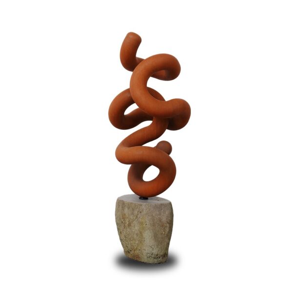 A twisted, abstract terracotta sculpture with looping curves is mounted on a rough stone base against a white background.